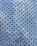 Blue and white small-print cotton table cover featuring a delicate micro-pattern and a contrasting checkered border trim.
