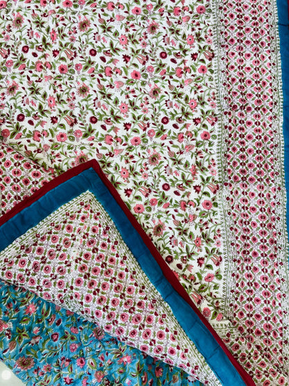 Floral patterned fabric with red and blue borders