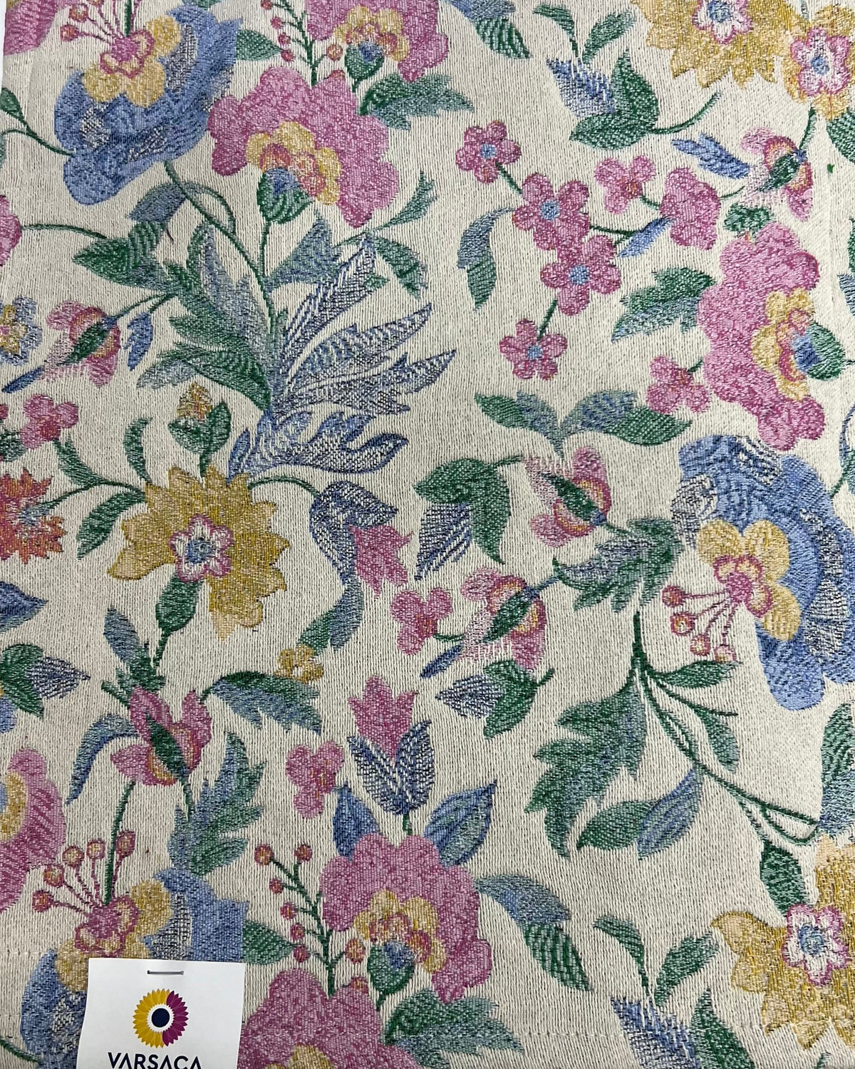 Botanical floral jacquard cotton placemat featuring a woven vintage garden print with pink, yellow, and blue flowers on a neutral base.