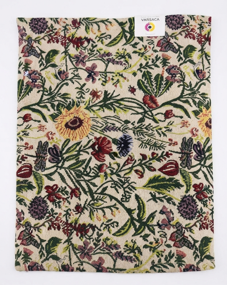 Botanical jacquard cotton placemat featuring a colorful woven floral garden pattern with vibrant blooms and green foliage.