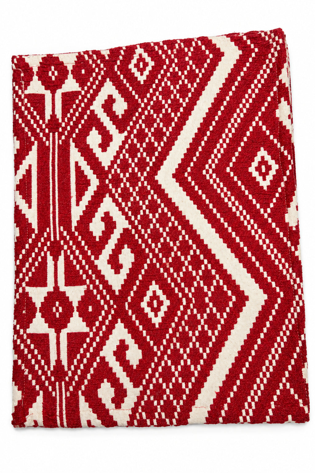 Crimson red and cream geometric jacquard cotton placemat featuring an intricate woven Aztec and diamond pattern.