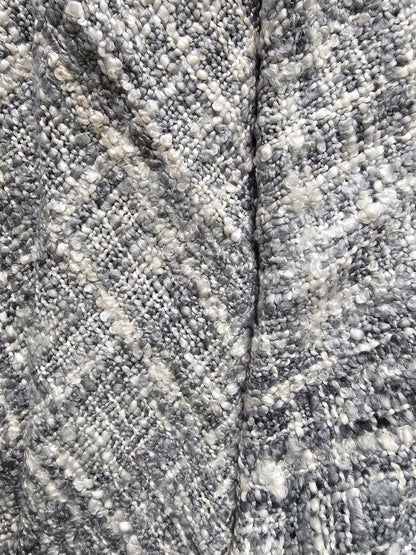 Close-up of textured stone surface with a crack running through it