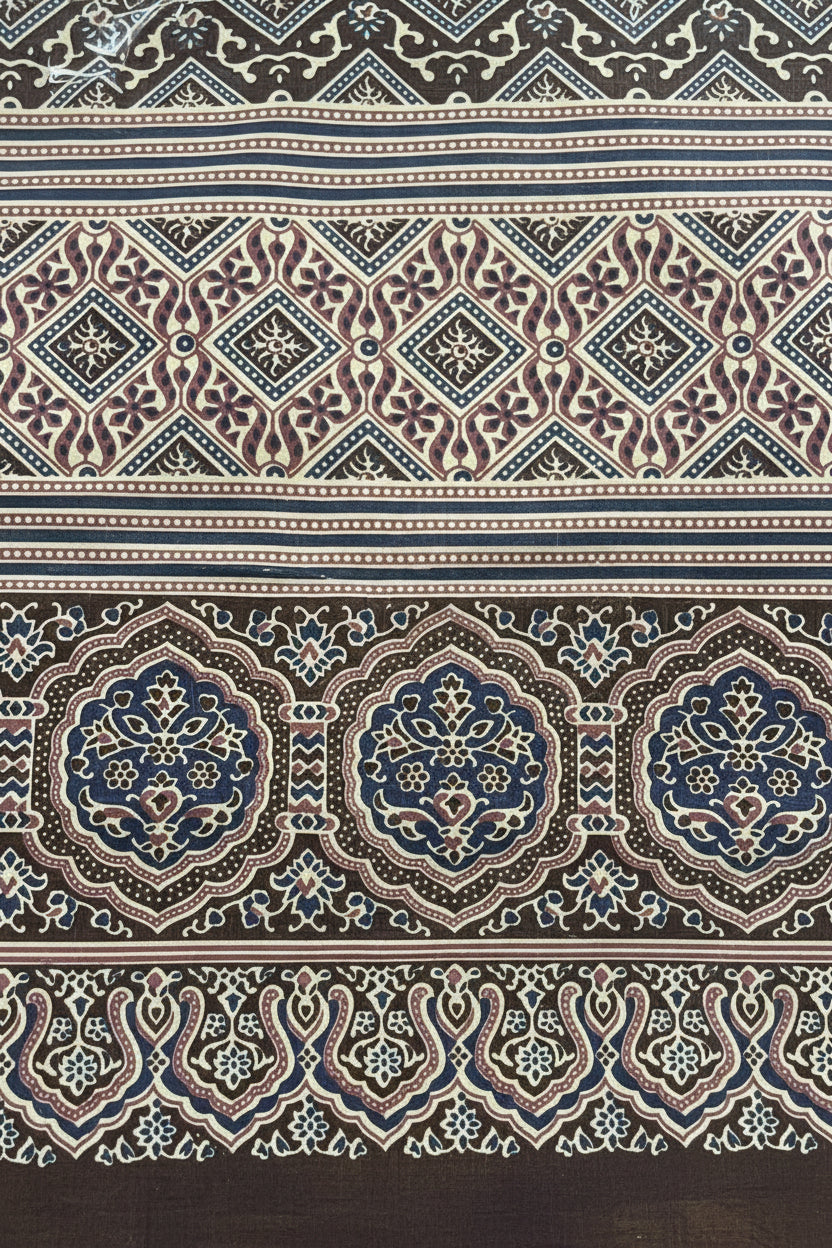 Deep blue and brown cotton bed sheet featuring a traditional block-printed geometric pattern and ornate floral border details.