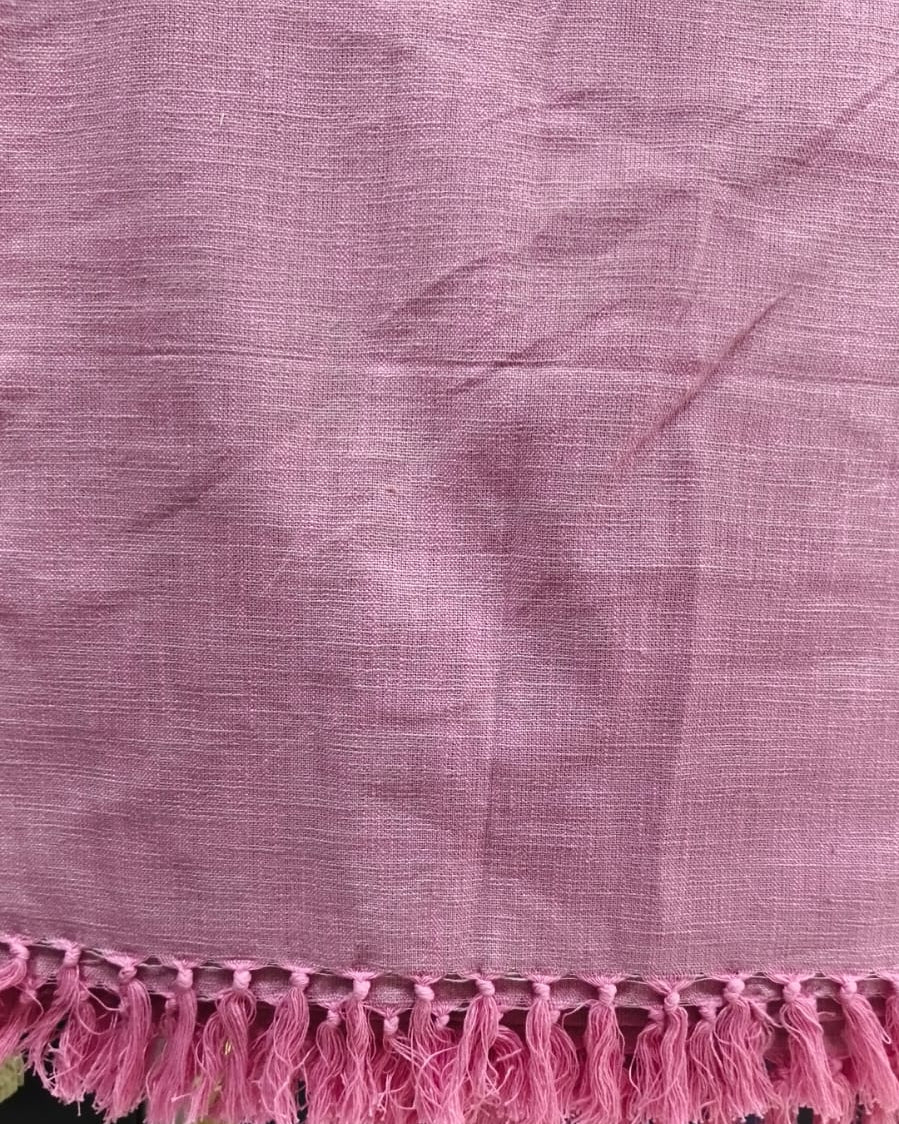 Dusty rose handloom slub cotton king size bed cover featuring a textured solid weave and handcrafted fringe tassels.