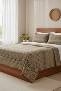 Earth brown and gold cotton bed sheet featuring a traditional block-printed geometric pattern and ornate medallion border details.