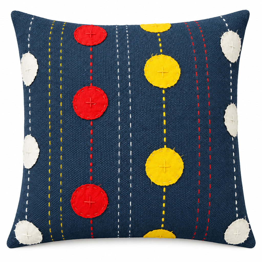 Square slate-blue cotton cushion cover featuring colorful applique circles in red, yellow, and white, accented with traditional hand-embroidered kantha stitching.