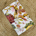 Fabric with floral and leaf pattern on a textured surface