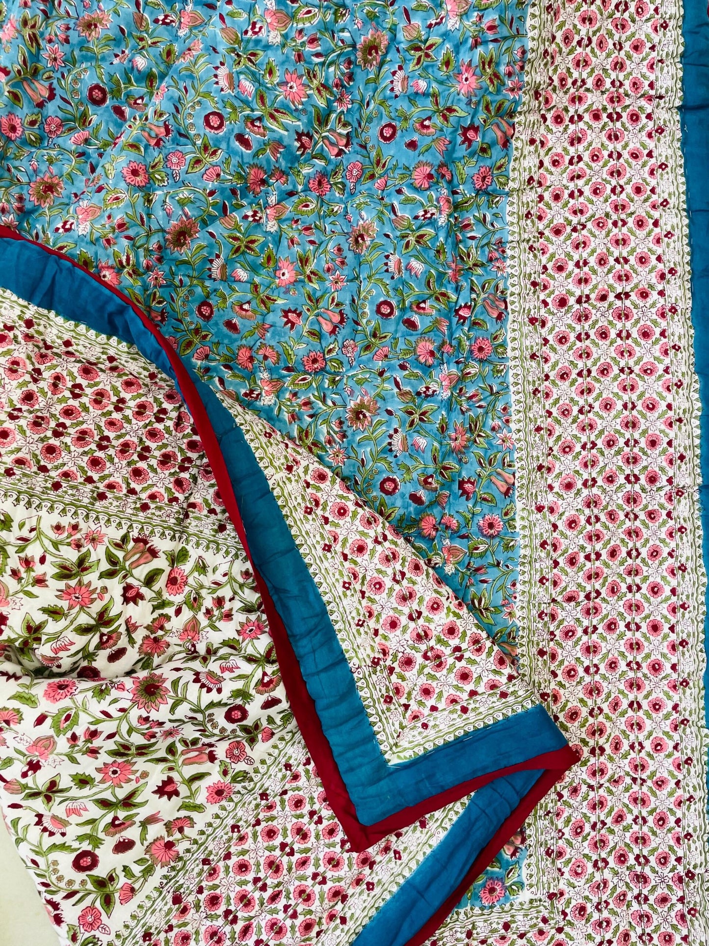 Floral patterned fabric with blue, pink, and red colors