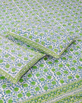 100x108 inch king size cotton bedsheet and matching green-bordered pillow covers styled with a traditional green and blue floral bud handblock print.