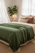 Close-up of green fabric with frayed edge