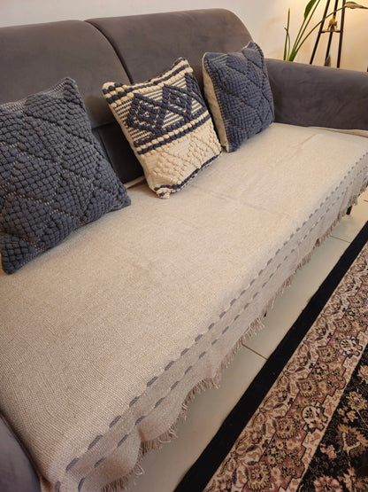 grey thread work cushion