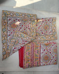 Folded 100x108 inch king size cotton bedsheet and matching pillow covers featuring a traditional red, yellow, and green handblock floral print.