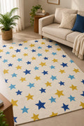 Close-up of an ivory cotton tufted kids rug featuring playful celestial stars in royal blue, sky blue, and mustard yellow.