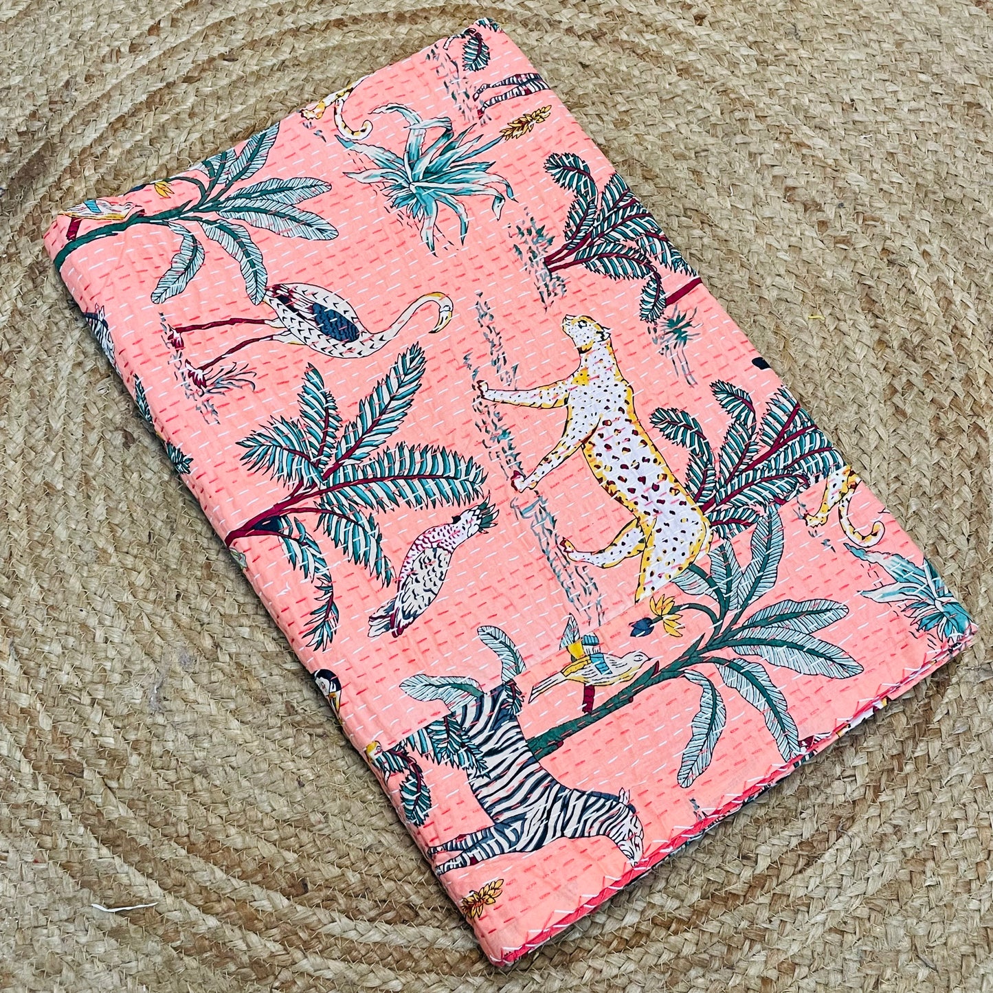 Floral and animal patterned fabric on a textured surface