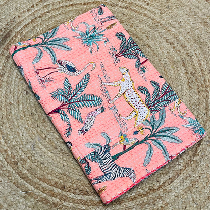 Floral and animal patterned fabric on a textured surface
