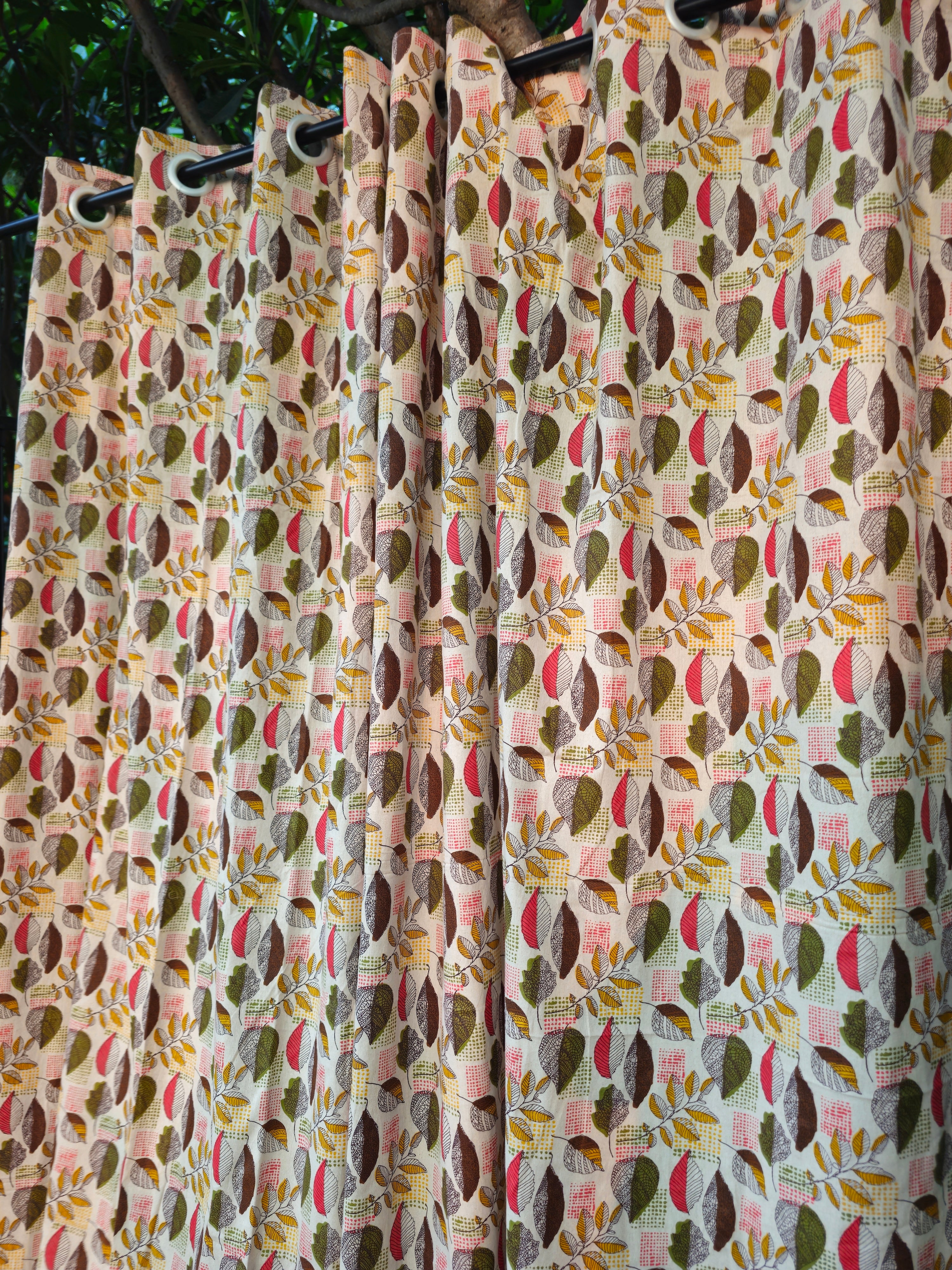 Patterned curtains with a mix of colors on a dark background