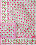 100x108 inch king size cotton bedsheet and matching striped pillow covers styled with a traditional magenta pink and green floral vine handblock print.
