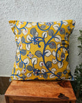 Mustard yellow cotton cushion cover featuring traditional blue and grey handblock floral vine prints with subtle accent embellishments.