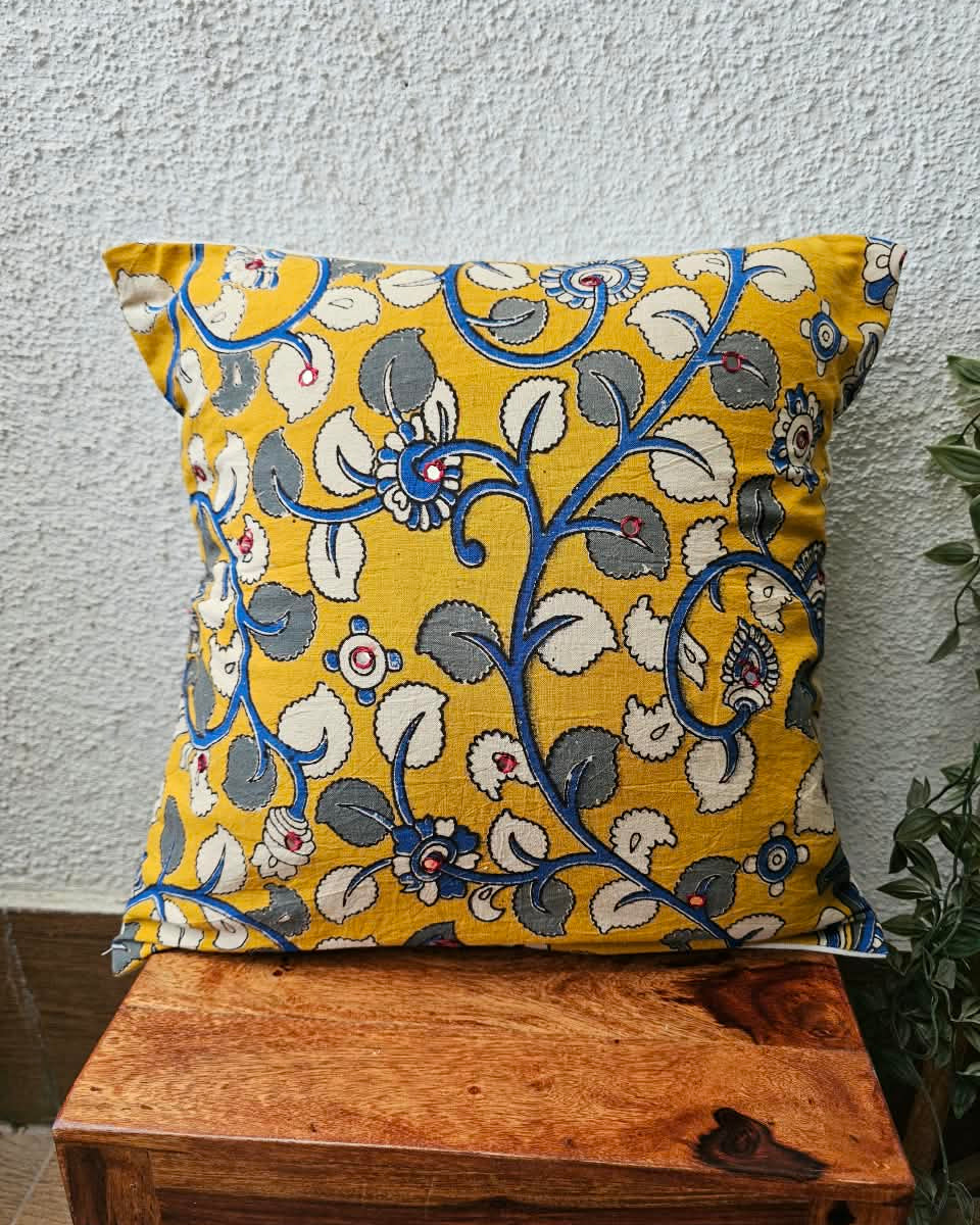 Mustard yellow cotton cushion cover featuring traditional blue and grey handblock floral vine prints with subtle accent embellishments.