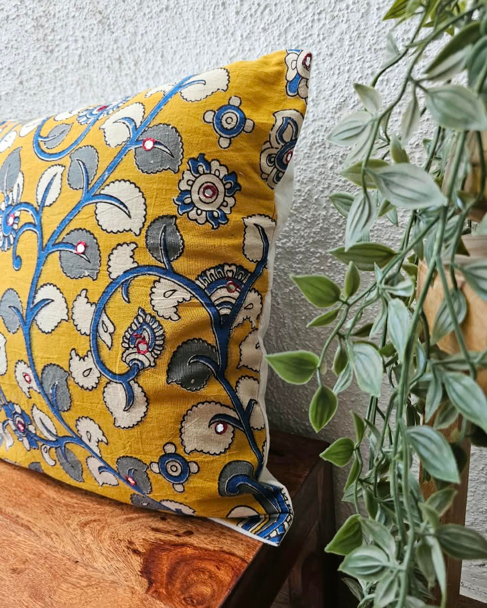 Mustard yellow cotton cushion cover featuring traditional blue and grey handblock floral vine prints with subtle accent embellishments.