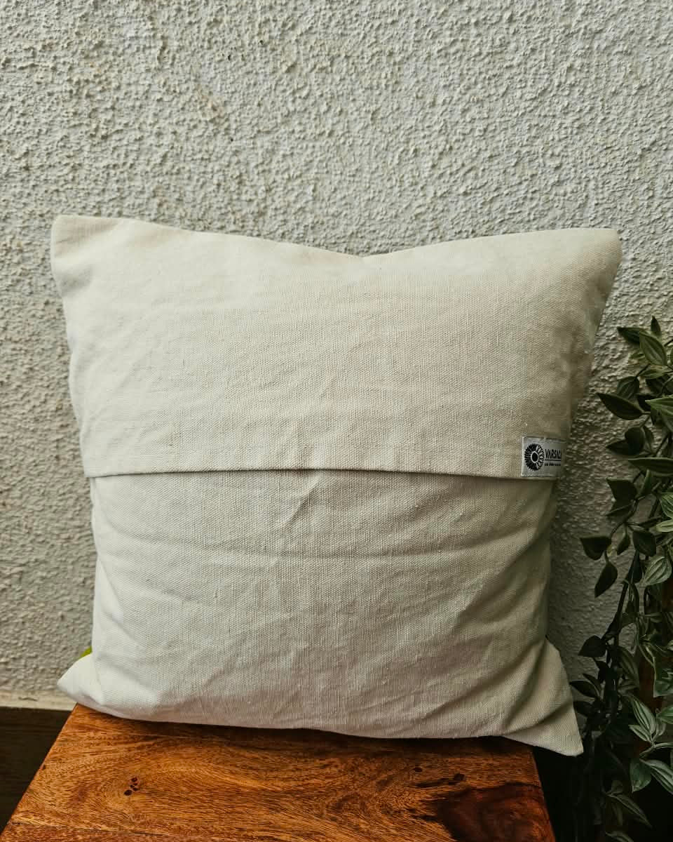 Natural off-white cotton cushion cover featuring traditional blue and green handblock floral vine prints with subtle accent embellishments.