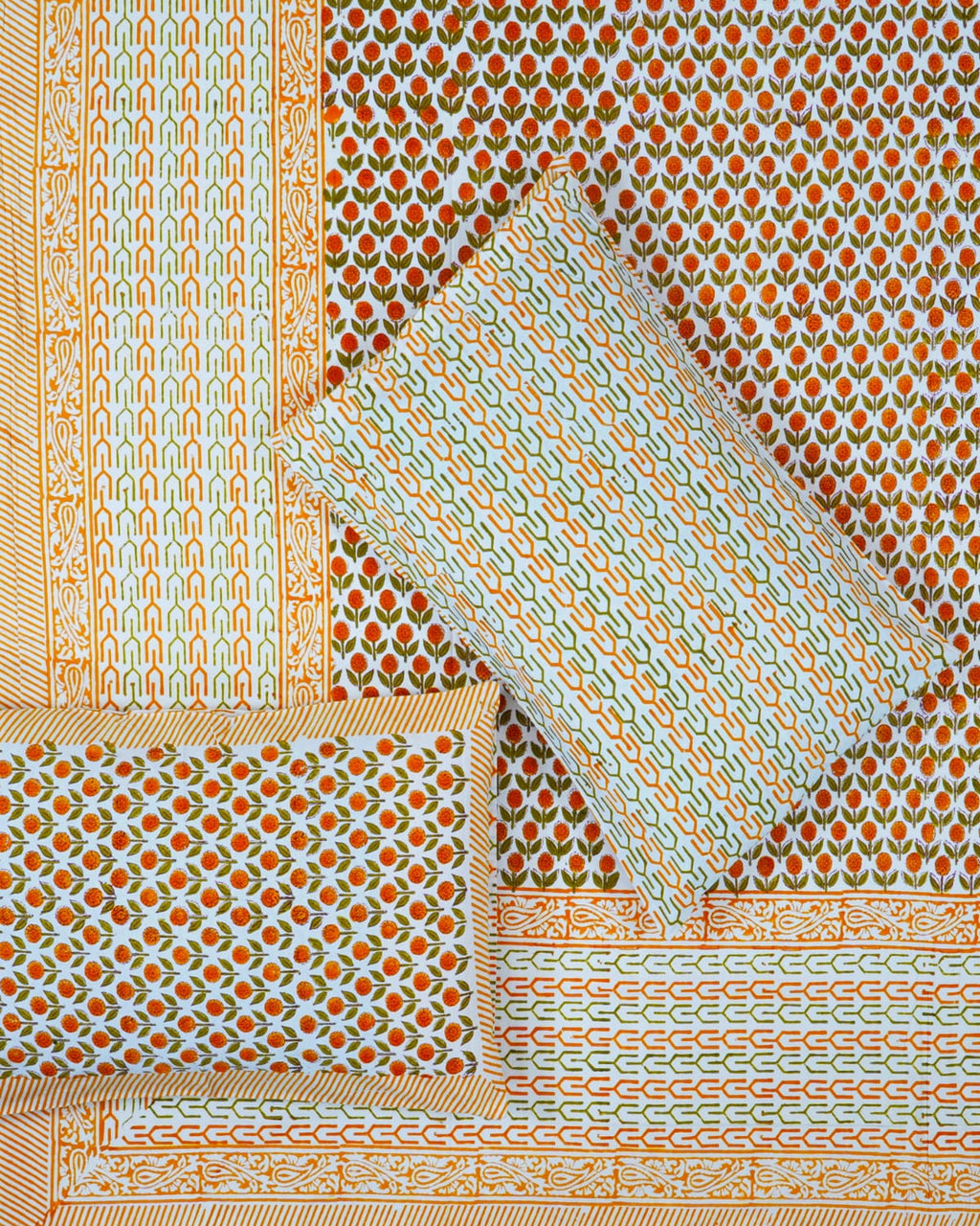 100x108 inch king size cotton bedsheet and matching pillow covers styled with a traditional orange and green floral bud handblock print.