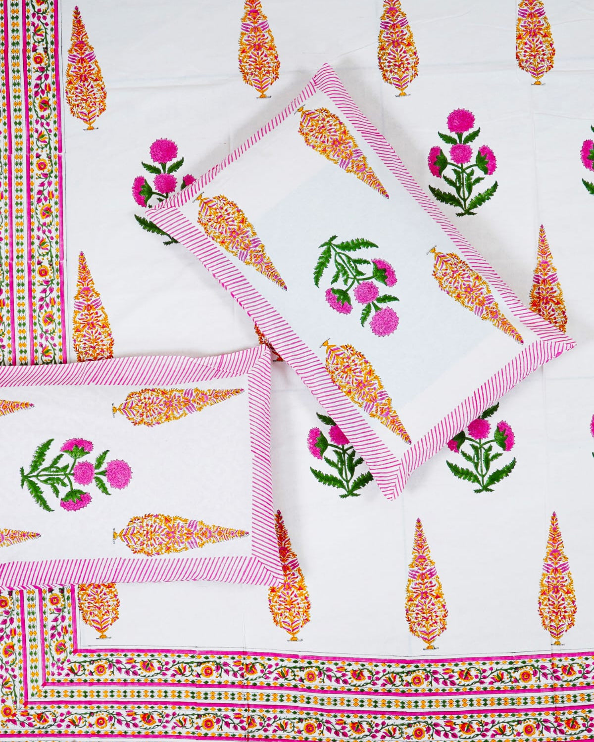 100x108 inch king size cotton bedsheet and matching pillow covers styled with a traditional pink floral and paisley handblock print.