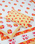 100x108 inch king size cotton bedsheet and matching pillow covers styled with a traditional pink and orange floral handblock print.
