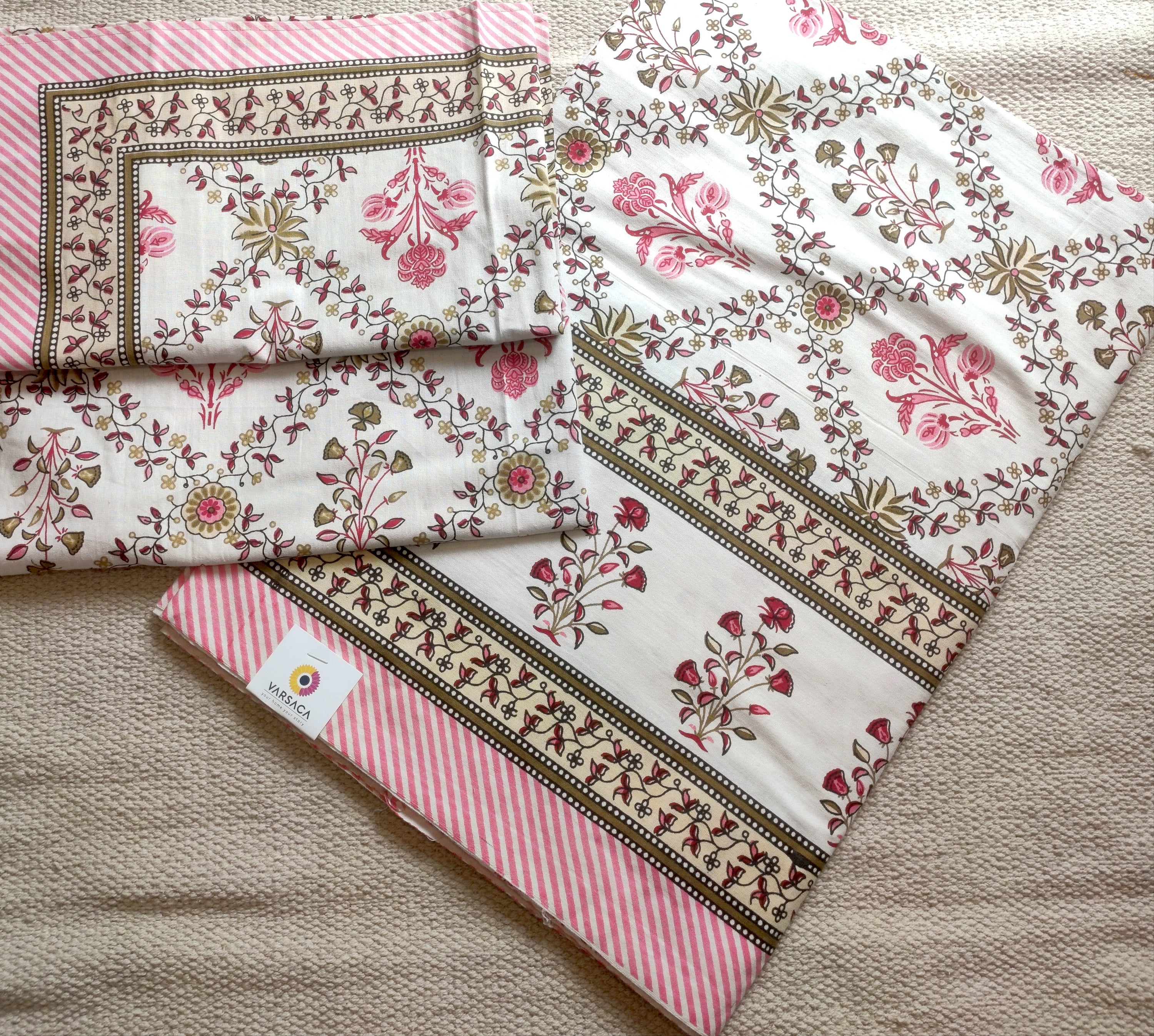 pink and white floral cotton bedsheet