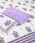 100x108 inch king size cotton bedsheet and matching chevron pillow covers styled with a traditional purple floral and palm tree handblock print.