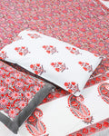 100x108 inch king size cotton bedsheet and matching pillow covers styled with a traditional red floral and grey paisley handblock print.
