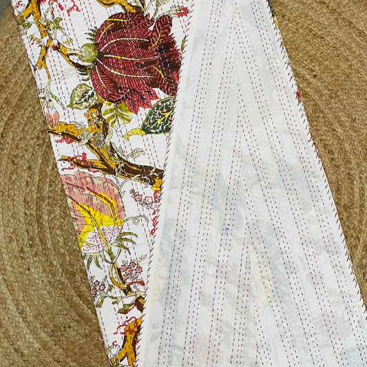 Textile with floral embroidery on a plain fabric background