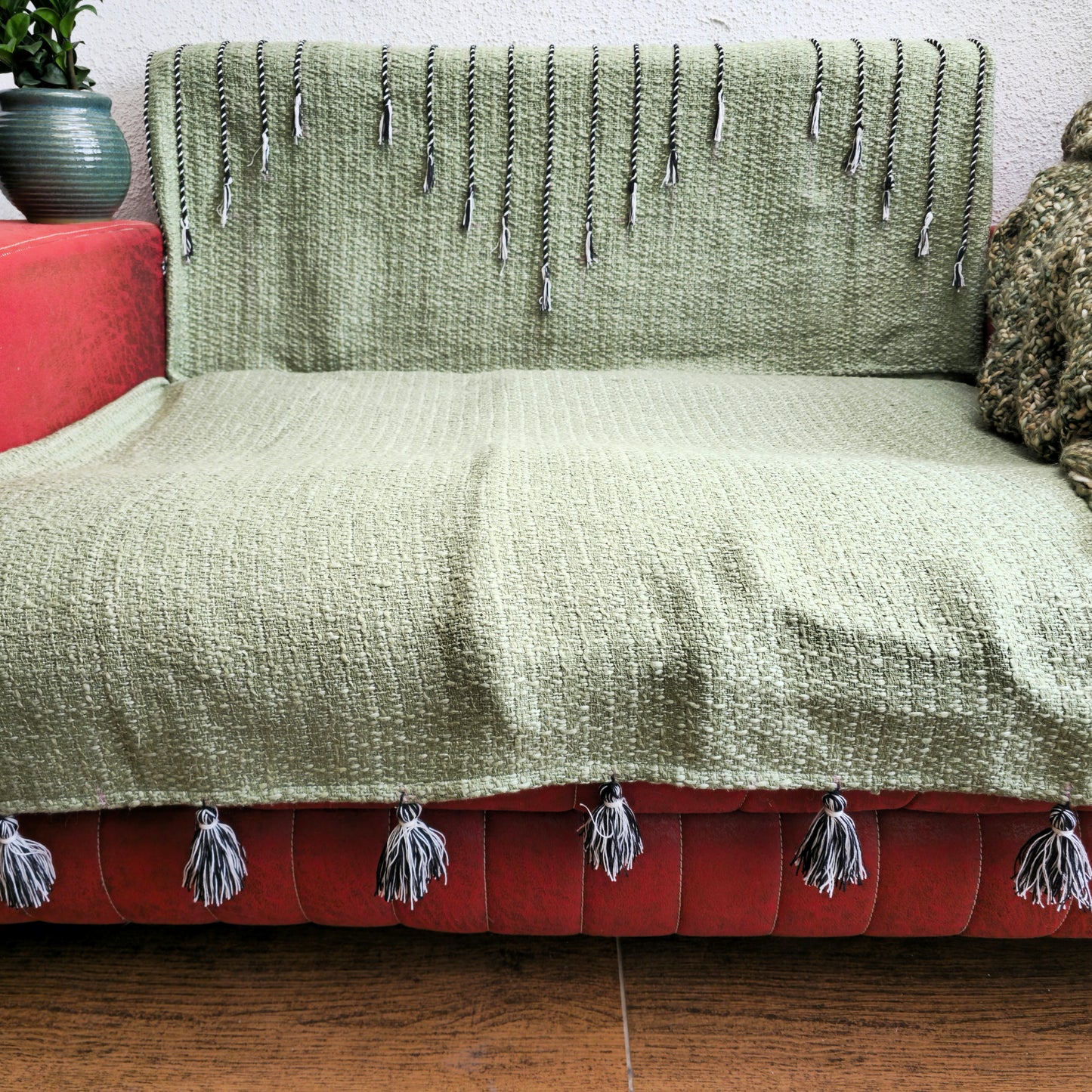 Green Handwoven Sofa Cover with Black Thread Embroidery & Tassels