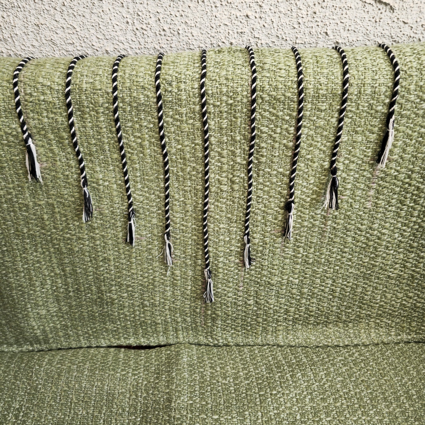 Green Handwoven Sofa Cover with Black Thread Embroidery & Tassels