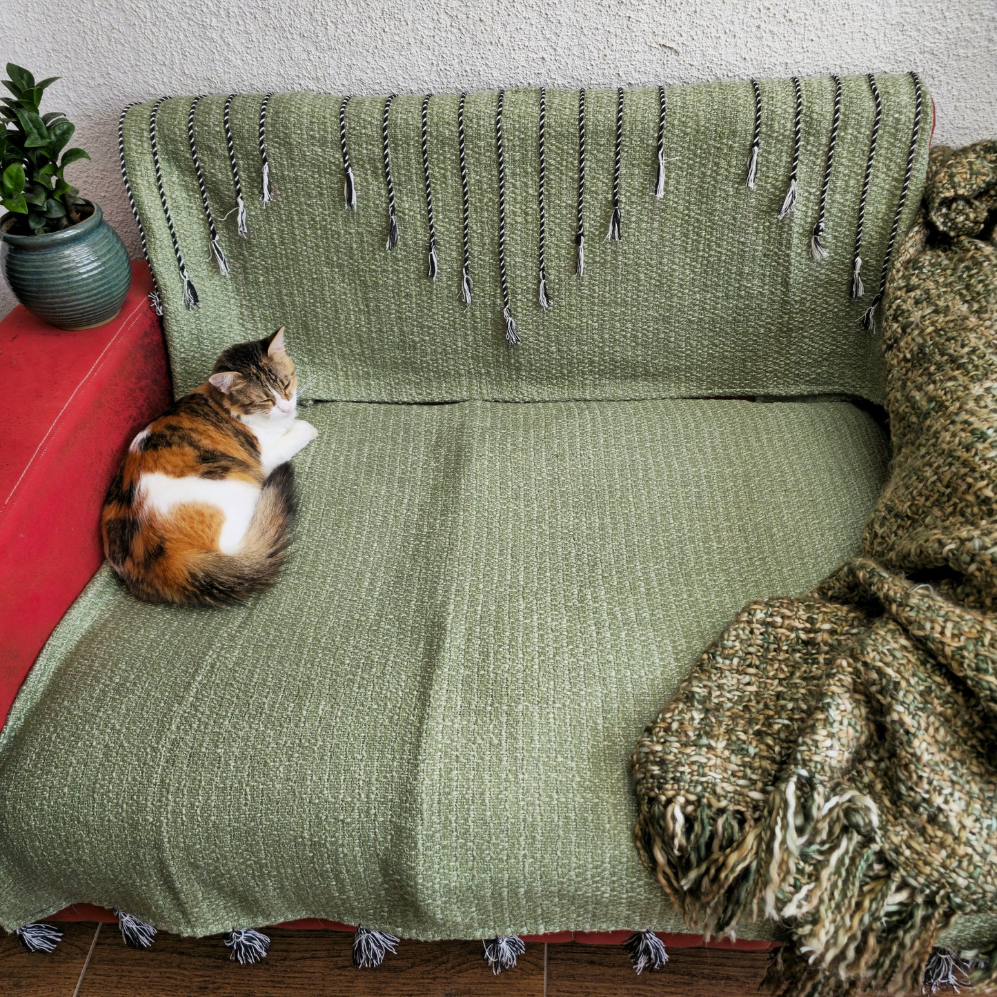 Green Handwoven Sofa Cover with Black Thread Embroidery & Tassels