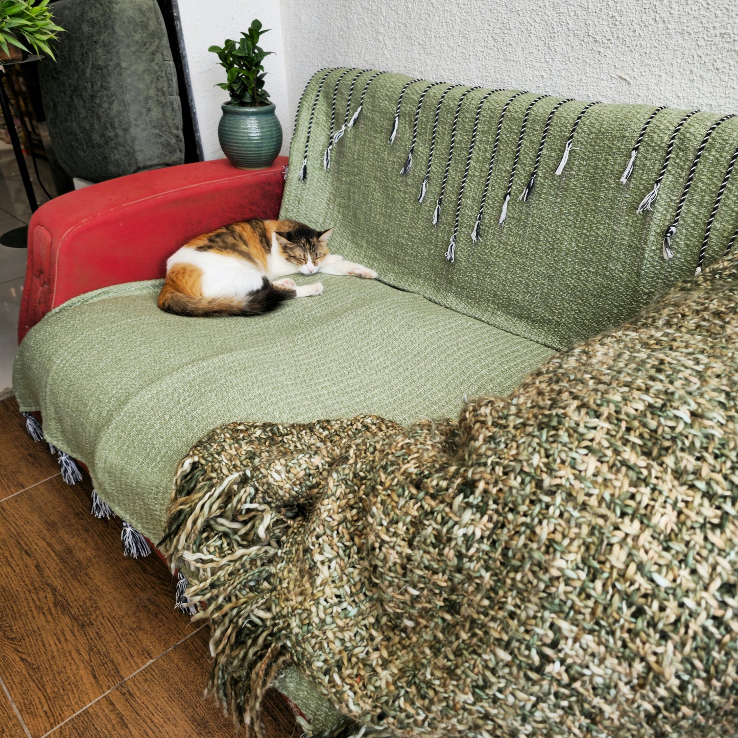 Green Handwoven Sofa Cover with Black Thread Embroidery & Tassels