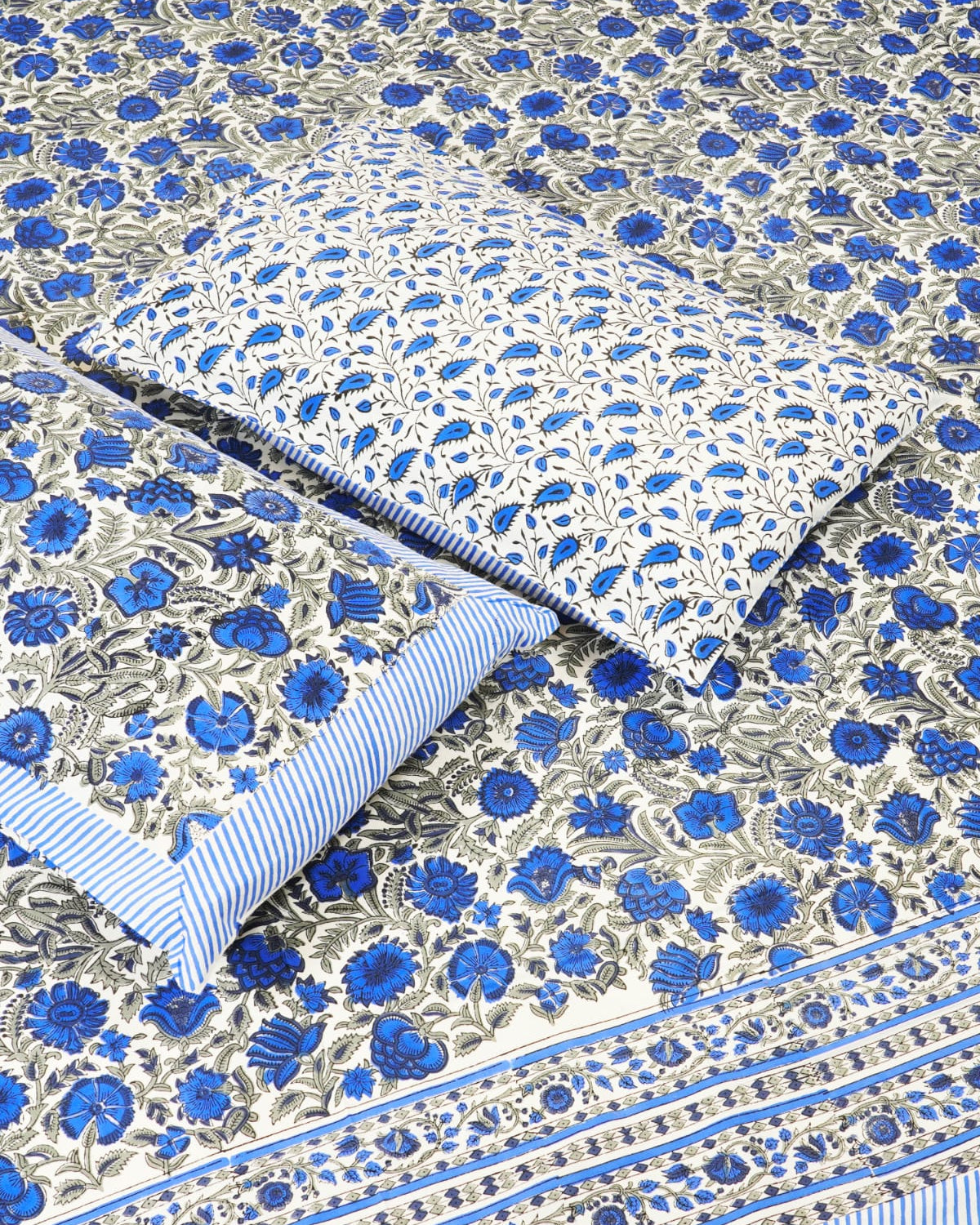 100x108 inch king size cotton bedsheet and matching pillow covers styled with a traditional royal blue and grey handblock floral print.