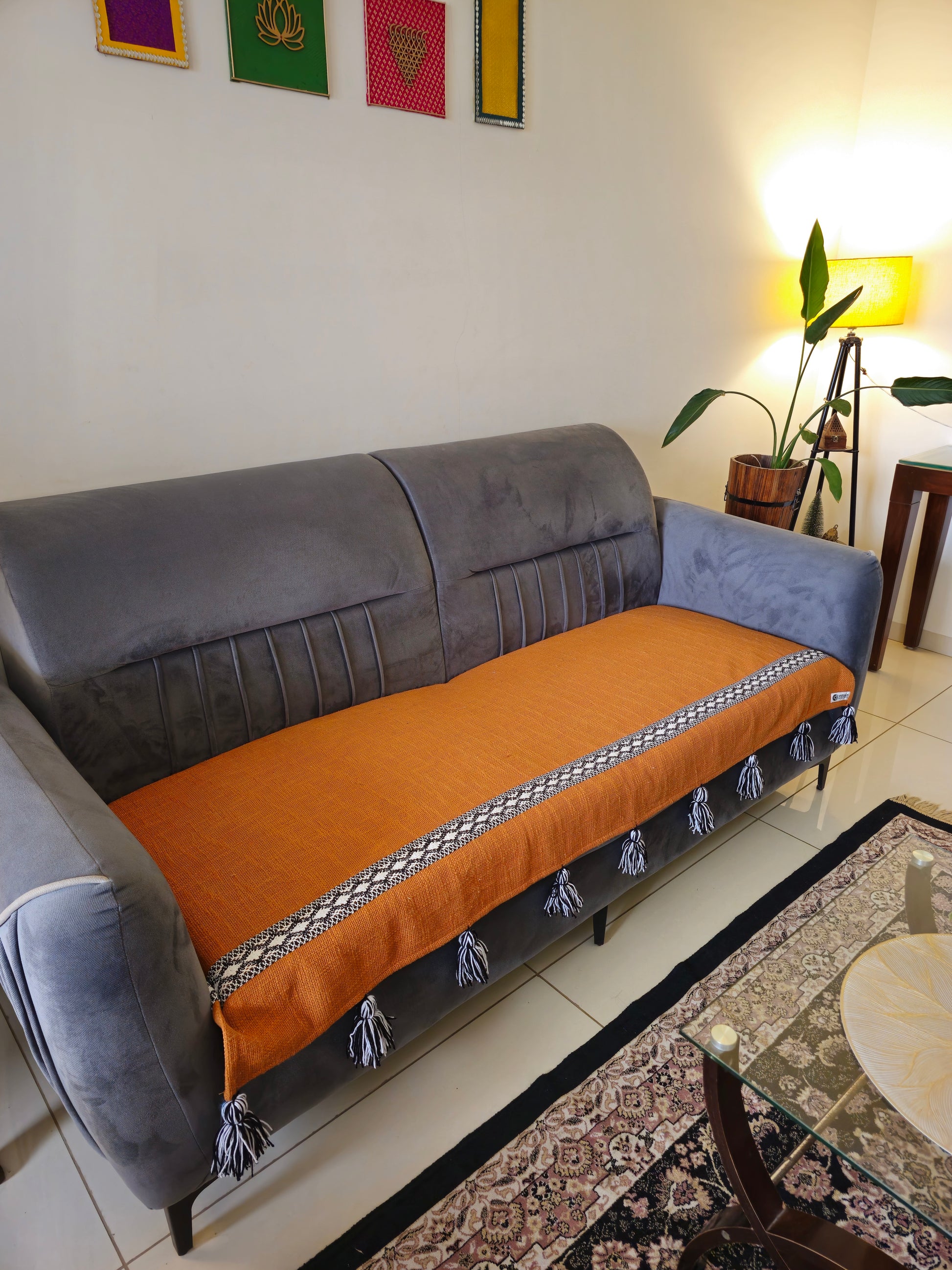 rust orange sofa cover with tassels