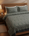 Sage green and charcoal cotton bed sheet featuring a traditional block-printed medallion and floral pattern with coordinating border details.