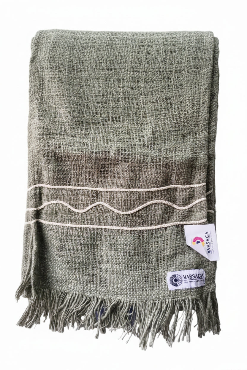 Sage green slub cotton handloom table runner featuring beige braided wave cord details and a fringed hem, with Vasaca brand labels.