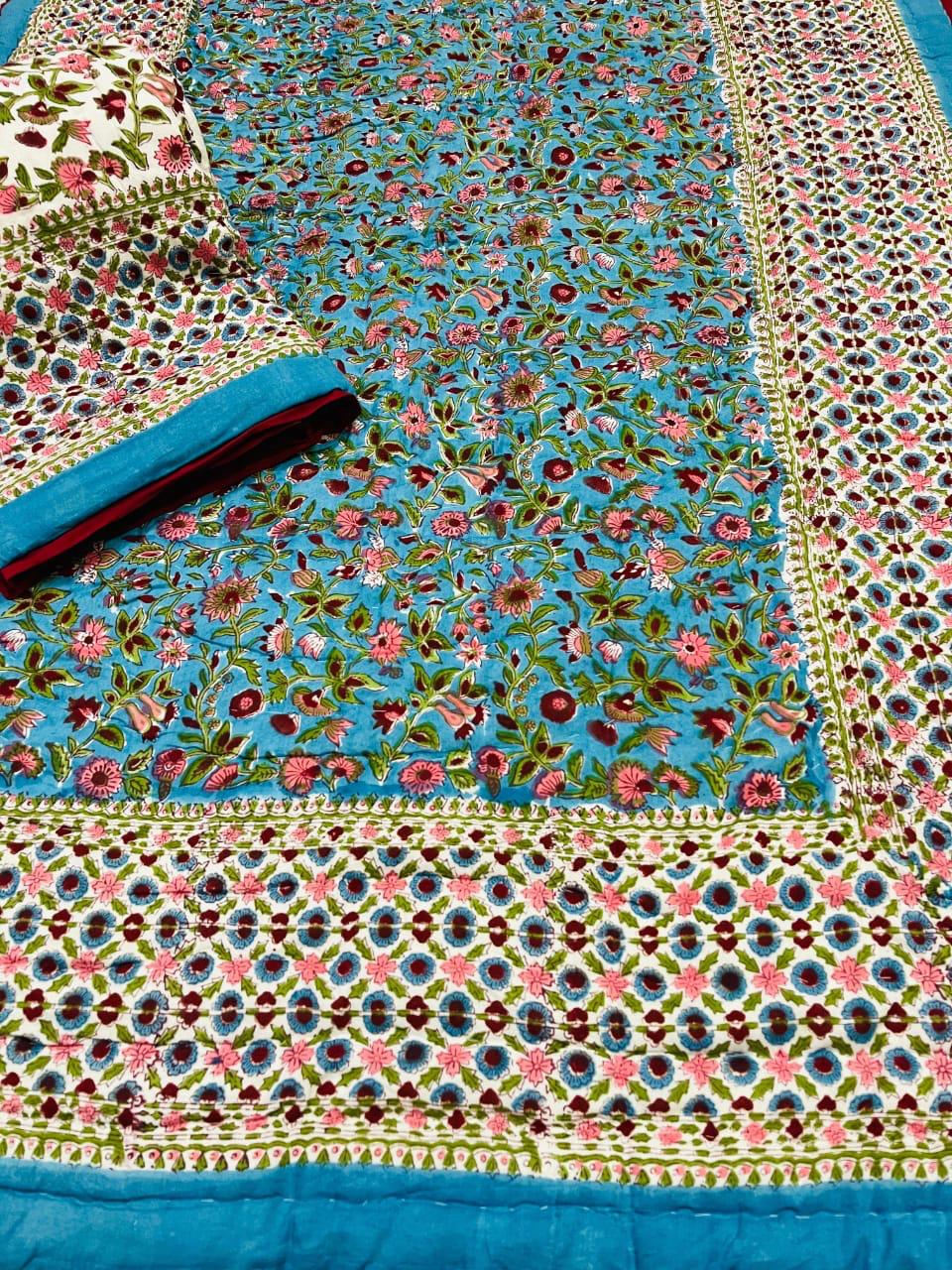 Colorful floral patterned fabric with a blue border