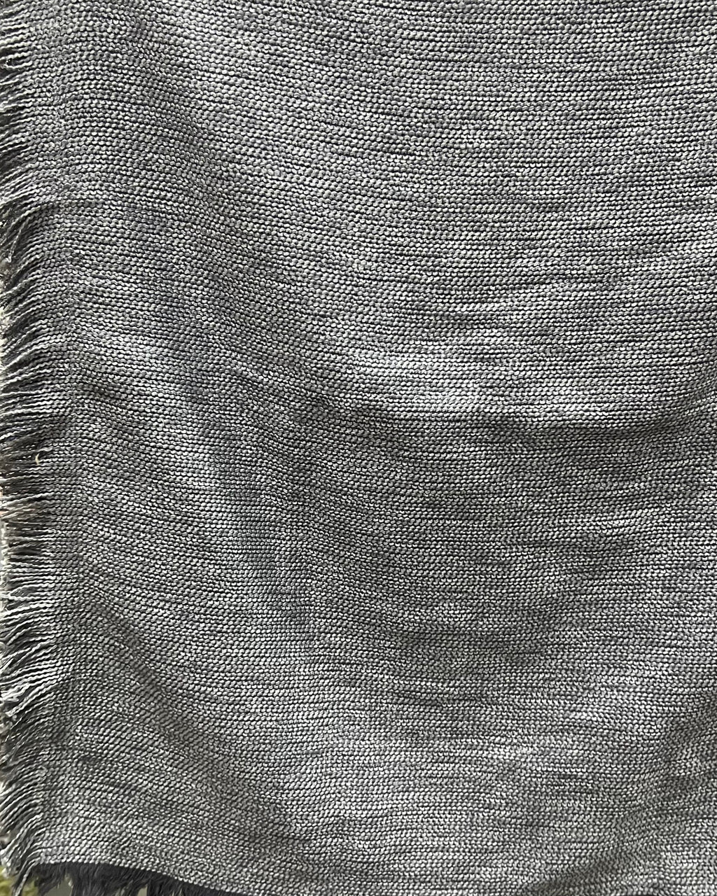 Solid grey handloom cotton table cover featuring a rich textured slub weave and decorative fringe tassels along the edge.