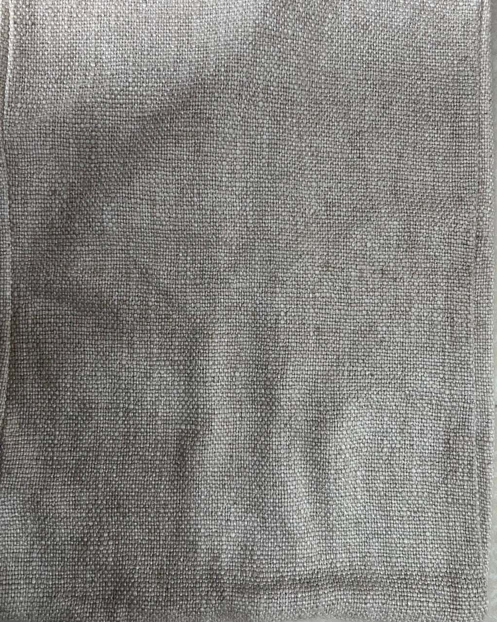 Rectangular solid neutral textured cotton cushion cover in a versatile grey-taupe shade, laid flat on a light surface.