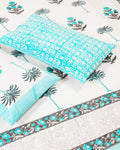100x108 inch king size cotton bedsheet and matching striped pillow covers styled with a traditional turquoise floral and grey palm tree handblock print.