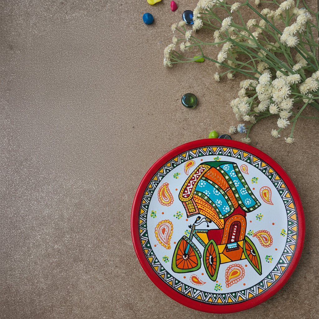 Fusion Indian folk art wall plate featuring a hand-painted cycle rickshaw with traditional Madhubani geometric patterns and a red border.
