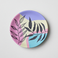 Minimalist 8-inch terracotta plate featuring black ink leaf sketches over soft lavender, pink, and teal color blocks.