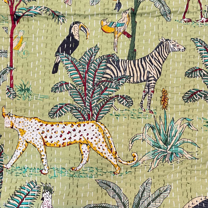 Patterned fabric with leopards, zebras, and birds on a green background
