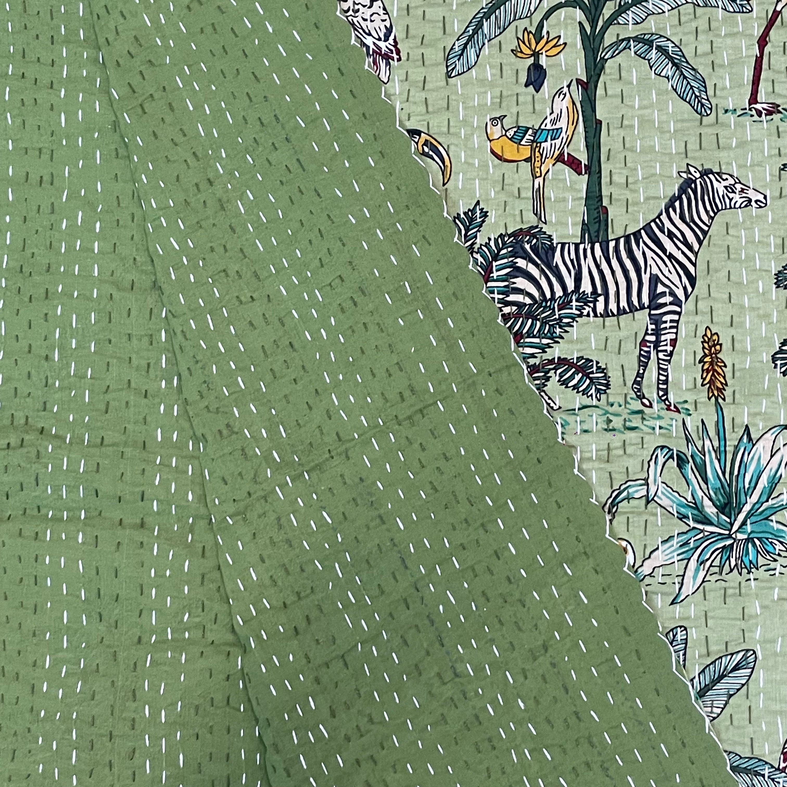 Fabric with zebra and nature pattern on a green background