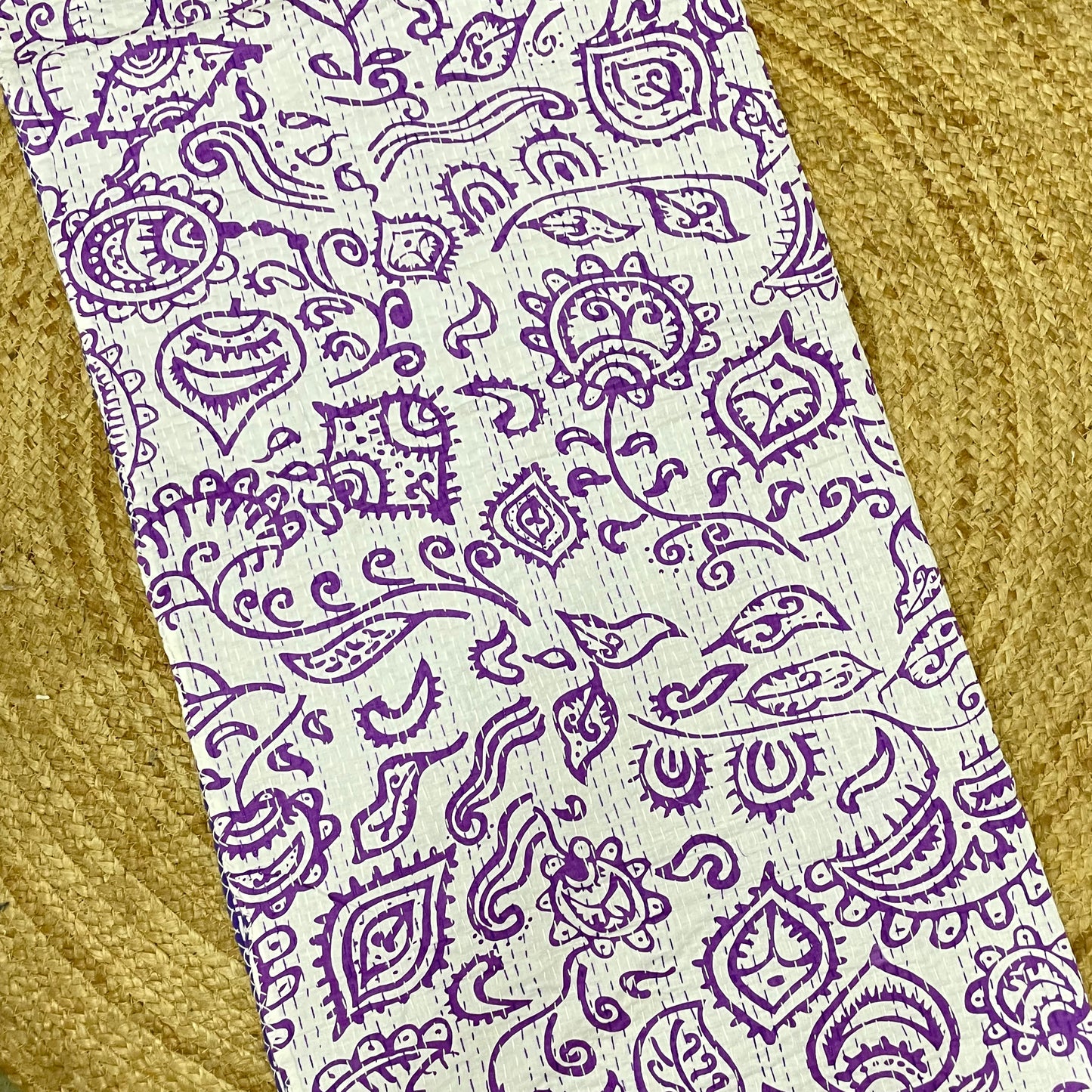 Purple paisley pattern on a white background