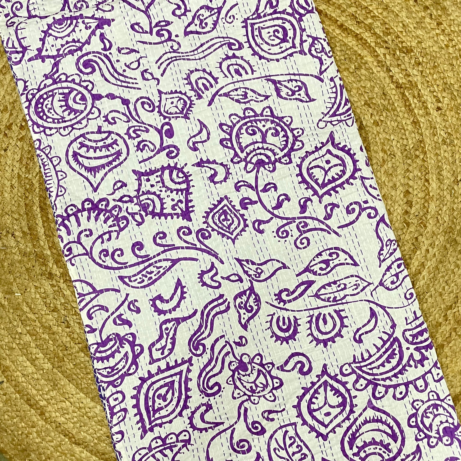 Purple paisley pattern on a white background